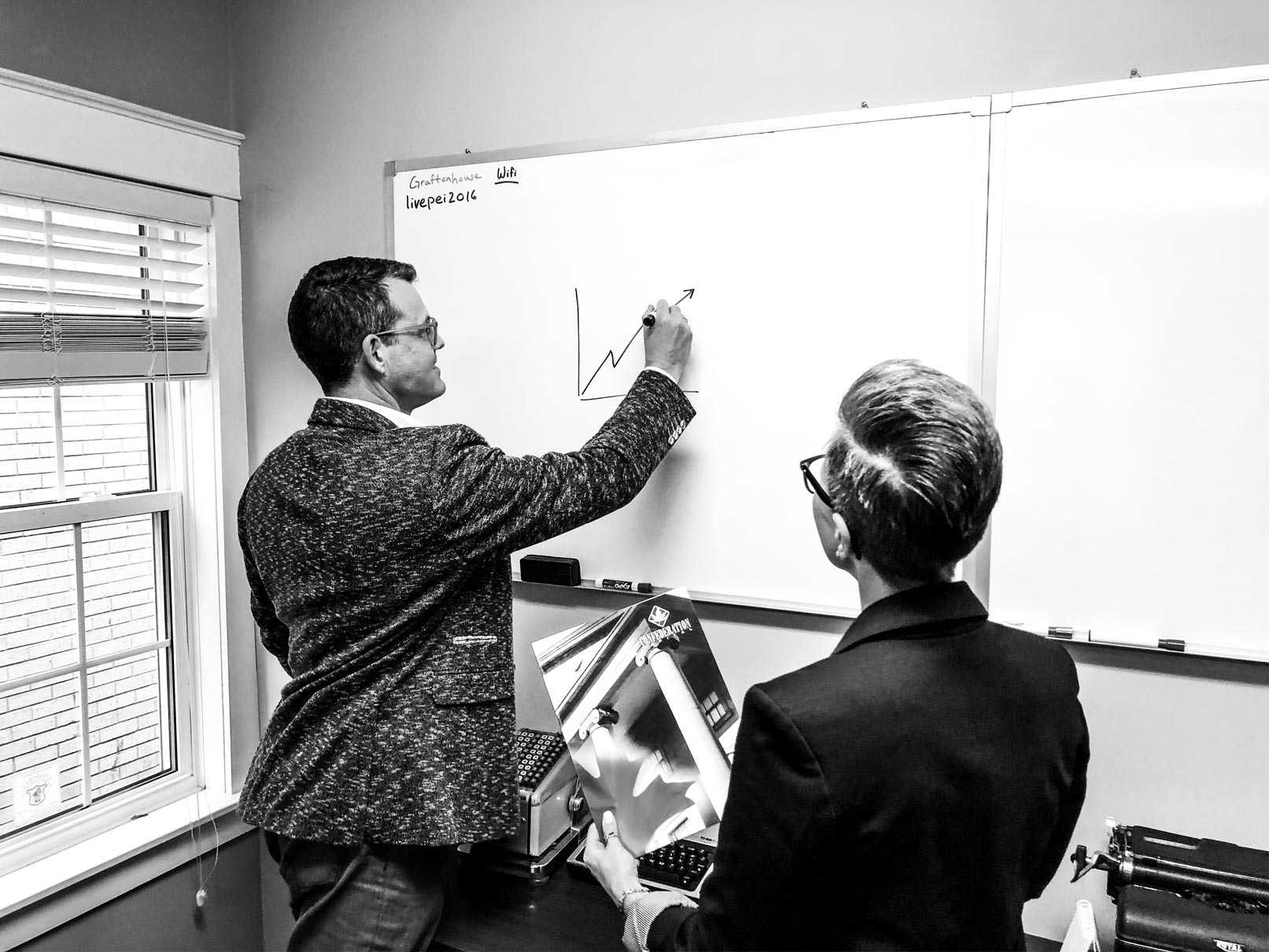 Blake Doyle drawing diagram on whiteboard